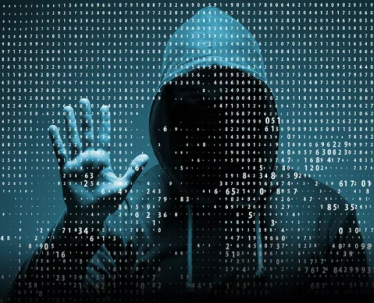 A hooded figure against a backdrop of binary code, symbolizing cybersecurity and hacking.