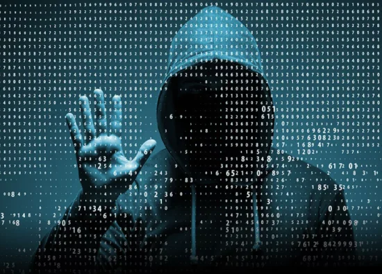 A hooded figure against a backdrop of binary code, symbolizing cybersecurity and hacking.